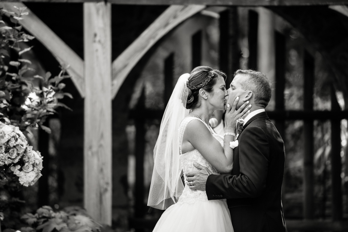 cloisters castle newlyweds first kiss Denver wedding photojournalist 
