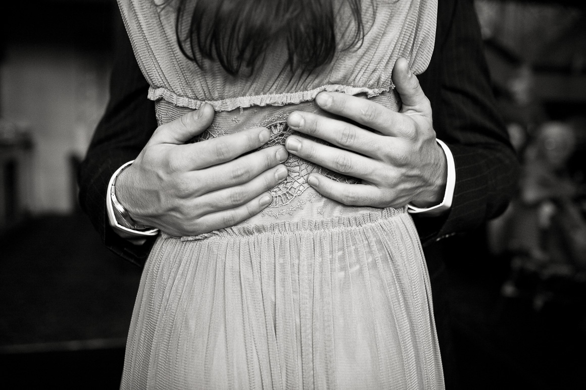 Hands in close embrace Denver wedding photojournalist