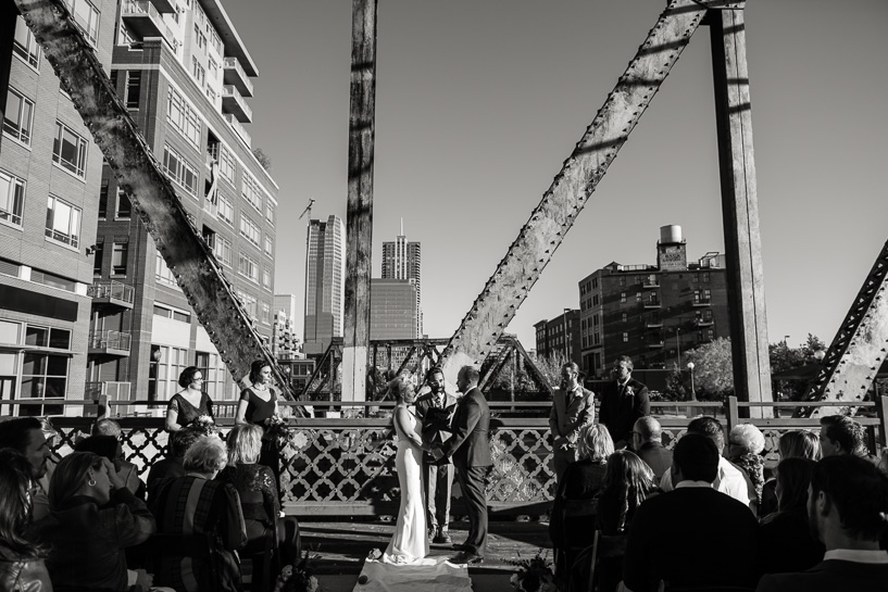 Downtown Denver wedding ceremony on bridge over Cherry Creek.