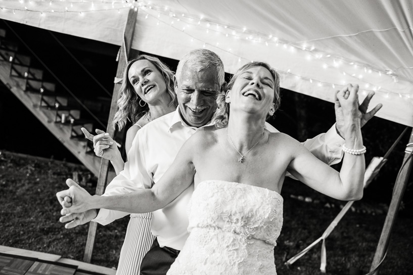 Backyard tent wedding by Denver wedding photojournalist