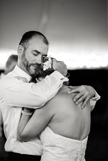 Denver wedding photographer captures groom and bride in tight embrace