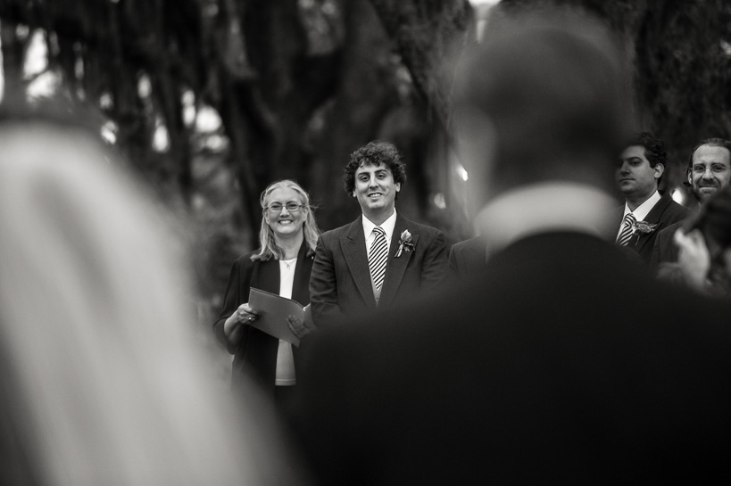 Groom sees bride for the first time during a wedding at the Sculpture Garden of the New Orleans Museum of Art, by Denver-based wedding photojournalist.