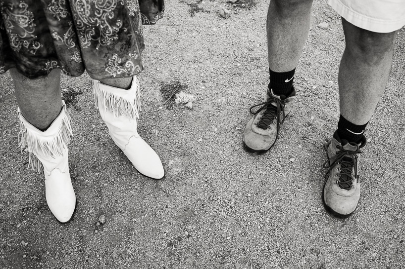 Guests in boots at wedding by Denver wedding photographer