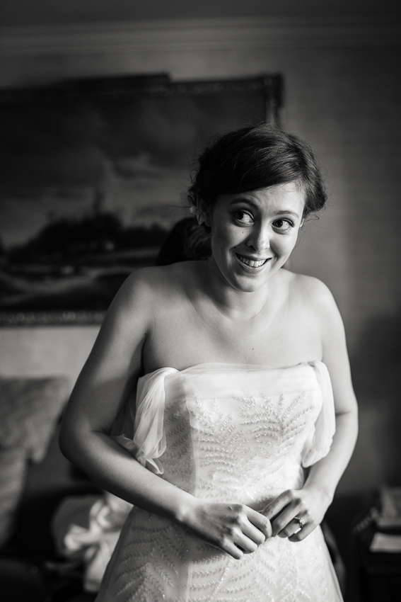 Bride getting ready in the Presidential suite at the Warwick Hotel by Denver wedding photojournalist.