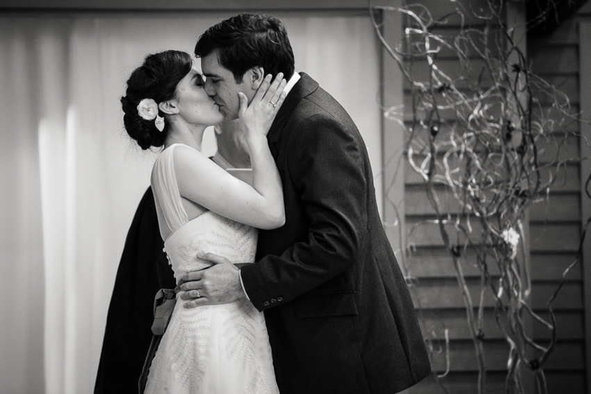 Sealing vows with a kiss during a denver wedding.