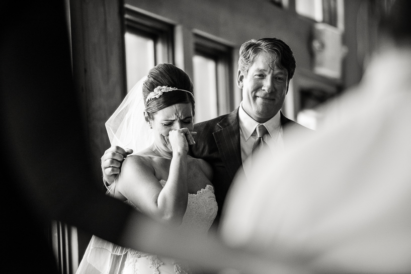 Bride cries during Vail wedding at Spruce Saddle Lodge in Beaver Creek
