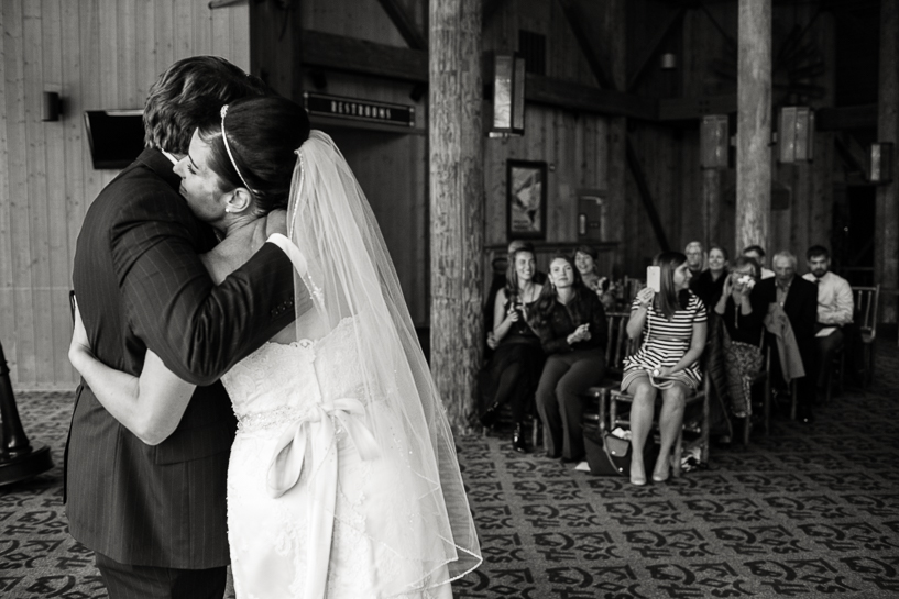 Bride and groom embrace after Spruce Saddle Lodge wedding in Beaver Creek.