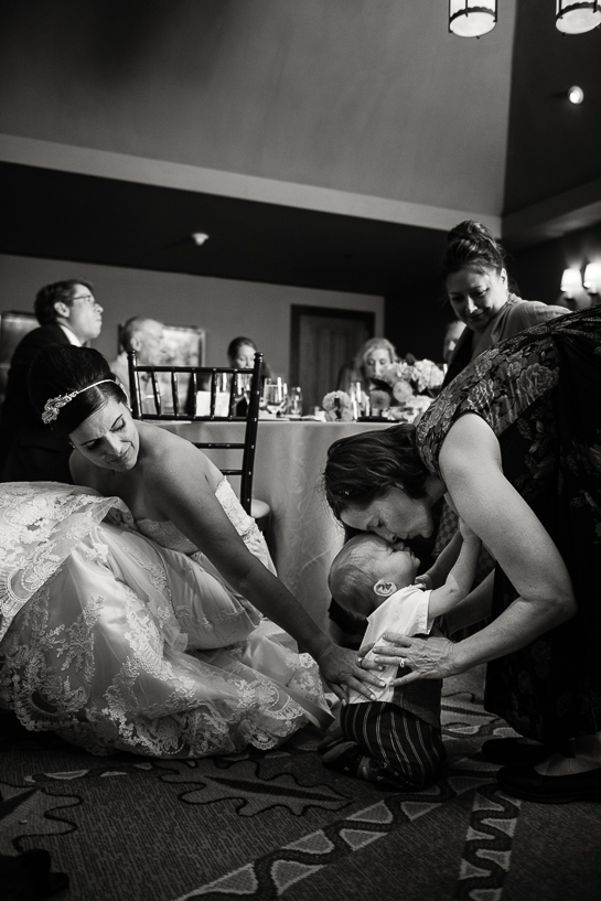 Denver wedding photojournalist captures bride and sister at Four Seasons Vail wedding reception.
