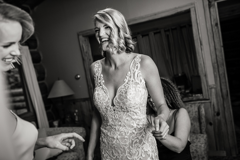 black and white Aspen wedding photography shows bride preparing for Aspen wedding.
