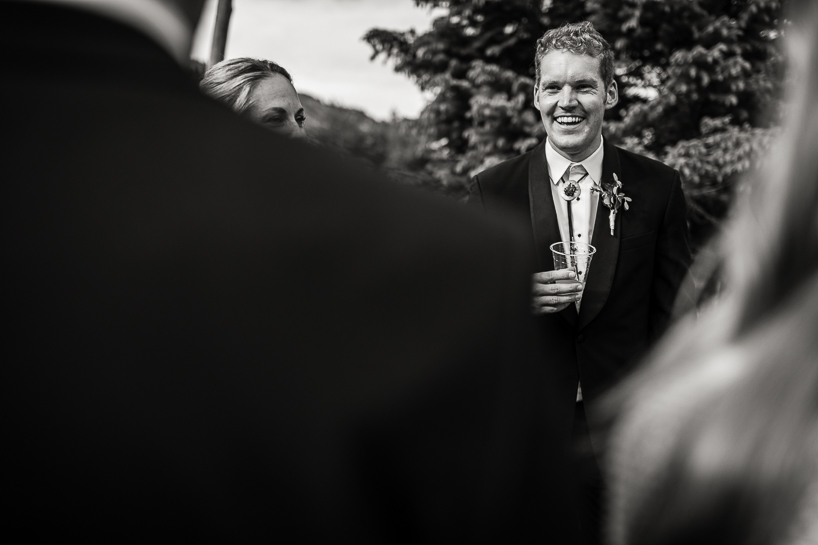 Groom during cocktails at an Aspen mountain wedding.