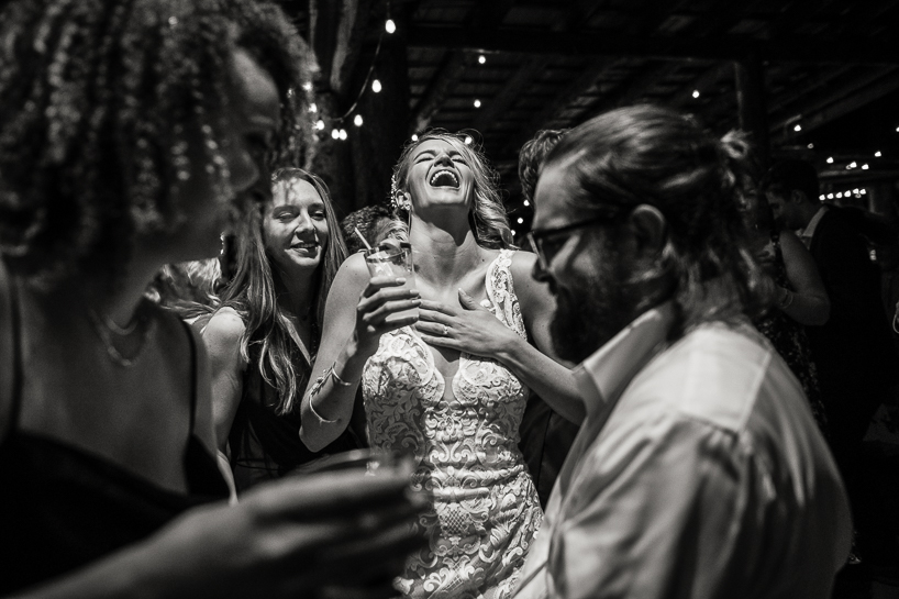 Bride laughing at Aspen wedding reception.