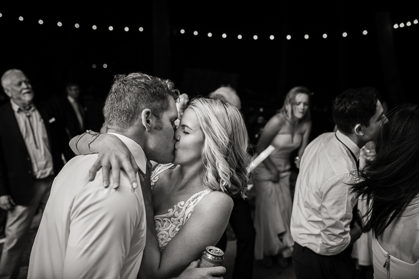 Bride and groom kissing on the dance floor of a T-Lazy-7 ranch in Aspen, Colorado.