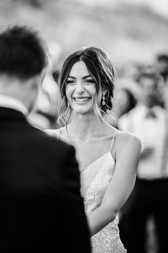 Bride during groom's vows, by Denver wedding photographer.
