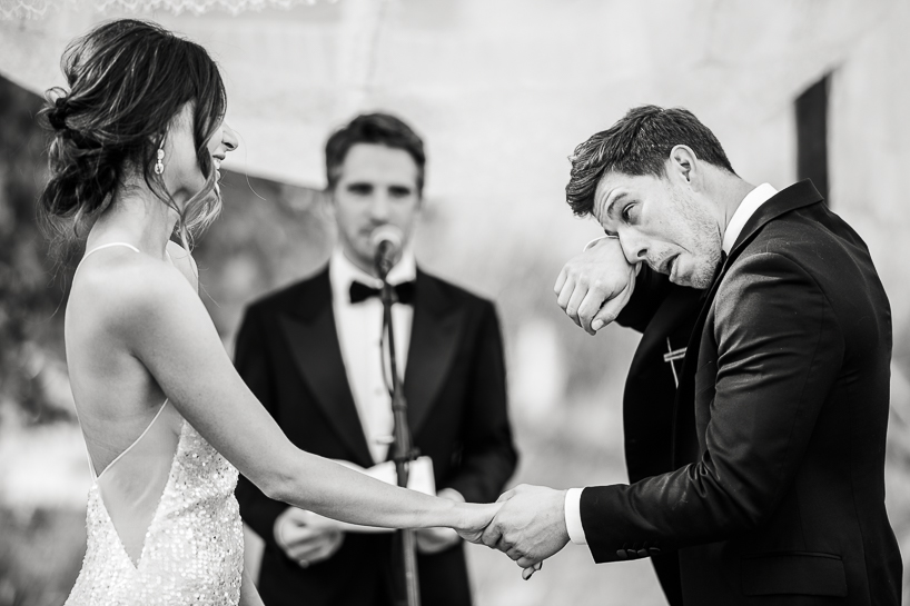 Denver wedding photographer captures groom tearing up during ceremony.