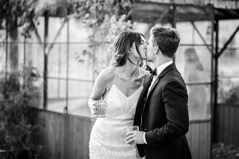 Denver wedding photographer captures couple kissing after ceremony.